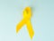 Yellow cancer awareness ribbon as symbol of childhood cancer awareness, Support the Troops Ribbon