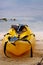 Yellow canoe on beach in Belize