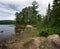 Yellow Canoe on Lake Shore Forest Adventure