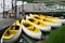 Yellow canoe mooring on the wooden port