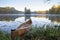 Yellow canoe on shore of beautiful lake with island in northern Minnesota at dawn