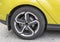 Yellow car closeup - rear wheel with light alloy rim