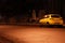 Yellow car in empty night street