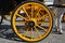 Yellow carriage wheel, Seville, Spain.