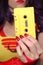 Yellow Cassette Tape With Woman in Retro clothing in background
