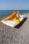 Yellow catamaran on a beach