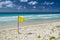 Yellow caution flag on a Barbados beach.