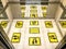 Yellow caution signs on elevator floor to keep social distancing between passengers