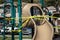 Yellow caution tape in english and spanish barring access to playground equipment at a park due to coronavirus quarantine