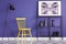 Yellow chair, black lamp, metal shelf, vases and painting set on