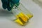 Yellow chemical transparent liquid in clear bottle holding by ch