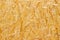 Yellow chipboard texture, wood background