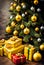 yellow christmas gift parcels under a tree decorated with matching baubles