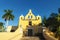 Yellow church with bell tower `Santa Isabel` in Merida, Yucatan, Mexico