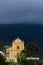 Yellow church in a Corsican landscape