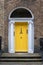 Yellow classic door in Dublin, example of georgian typical architecture of Dublin Ireland