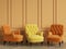 Yellow classic tufted chair among orange chairs are standing in an empty room with copy space