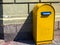 Yellow classical postbox in Dnipro, Ukraine. A large old floor-standing mailbox container for paper correspondence with