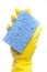 A yellow cleaning glove with a sponge