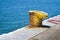 Yellow cleat for mooring boats