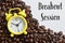 Yellow clock and coffee bean brown roasted with text BREAKOUT SESSION