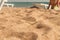 Yellow coarse sand on the beach by the sea