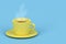 Yellow coffee cup with hot espresso