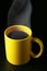 Yellow coffee cup with steam