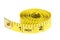 Yellow coiled tape measure on white