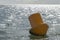 Yellow colored buoy in the sea