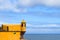 Yellow colour castle tower Fortaleza de Sao Tiago in Funchal against blue ocean water, Madeira island, Portugal