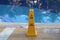 Yellow column near the pool