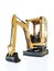 Yellow compact excavator on white