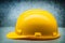 Yellow  construction helmet on metalic background close up side view