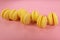 Yellow cookies on a pink background