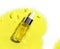 Yellow cosmetic liquid oil in  Dropper Bottle place on Potassium Chromate powder