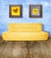 Yellow couch on grunge blue