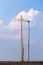 Yellow crane tower placing windmill blade with background of blue sky. Wind Turbine Construction