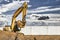 Yellow crawler excavator at the construction site. Earthworks at a construction site. Modern earthmoving equipment