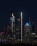 Yellow crescent moon over illuminated Philadelphia skyline at night