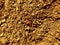 Yellow crumbly patchy sand. Dry soil texture and background. The background of the red soil. Abstract land. Natural abstraction.