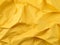 Yellow crumpled paper texture abstract background