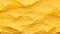 Yellow crumpled paper texture abstract background