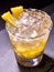 Yellow cube ice of cold drink with pineapple on