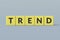 Yellow cubes with word trend on gray background