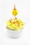 Yellow cupcake and smiley candle