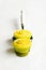 Yellow cupcakes on cake shovel, white background.