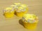 Yellow cupcakes with sprinkles