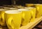 Yellow cups on shelf