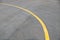 Yellow curve Traffic line on road floor texture and background